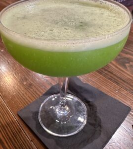 Image of a grass-green cocktail, the "Son of Godzilla"